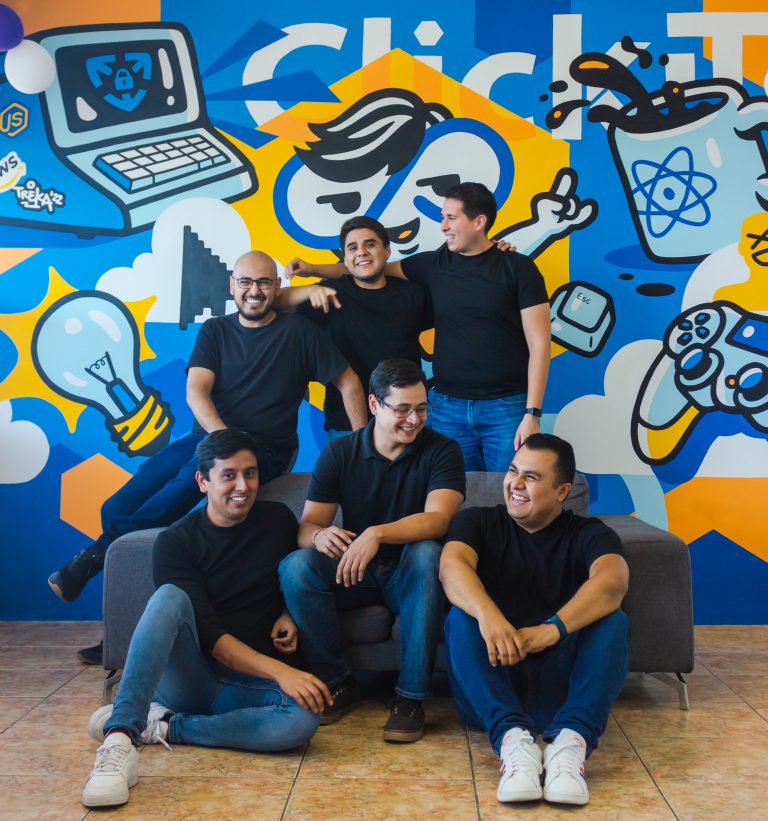 Six LATAM DevOps Engineers smiling each other